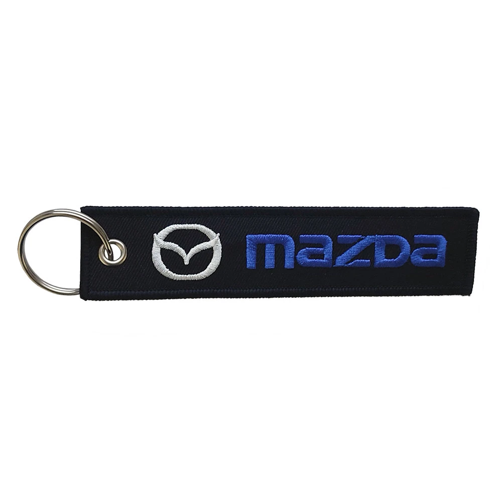 Υφασμάτινο κεντητό μπρελόκ με λογότυπο Mazda μαύρο Υφασμάτινο κεντητό μπρελόκ με λογότυπο Mazda μαύρο